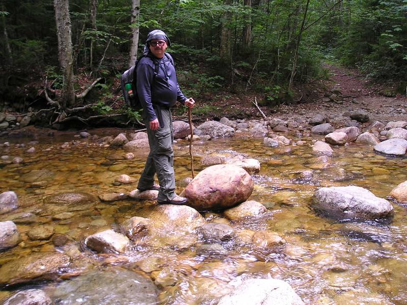 CdearBrook (19).JPG - Our last stream crossing of the day was on across the Cedar Brook. Last year we had to take our boots off to cross this stream. From here we stopped at the ranger pool for a quick swim in the river to cool off. Then we finished the last 3 miles to Lincoln Woods and our waiting car. After a quick clean up all of us headed to the Woodstock Inn for a victory dinner. Another great day in the woods.